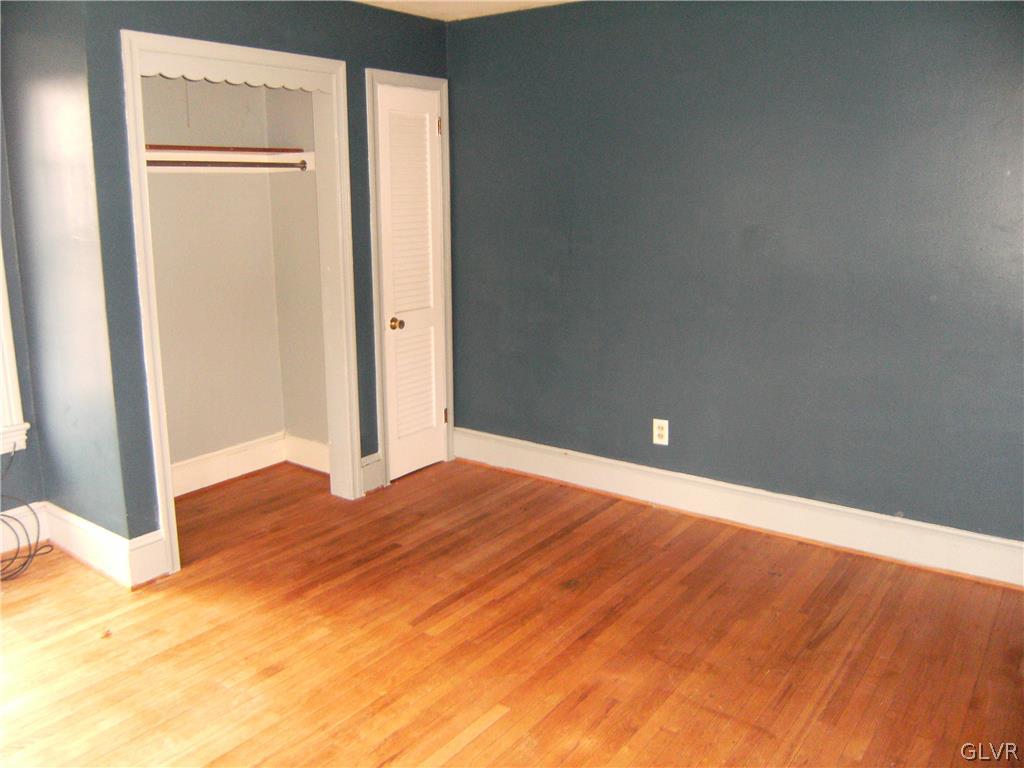 1115 Main Street Slatington, PA 18080 - Photo 14 of 19 a view of an empty room with wooden floor