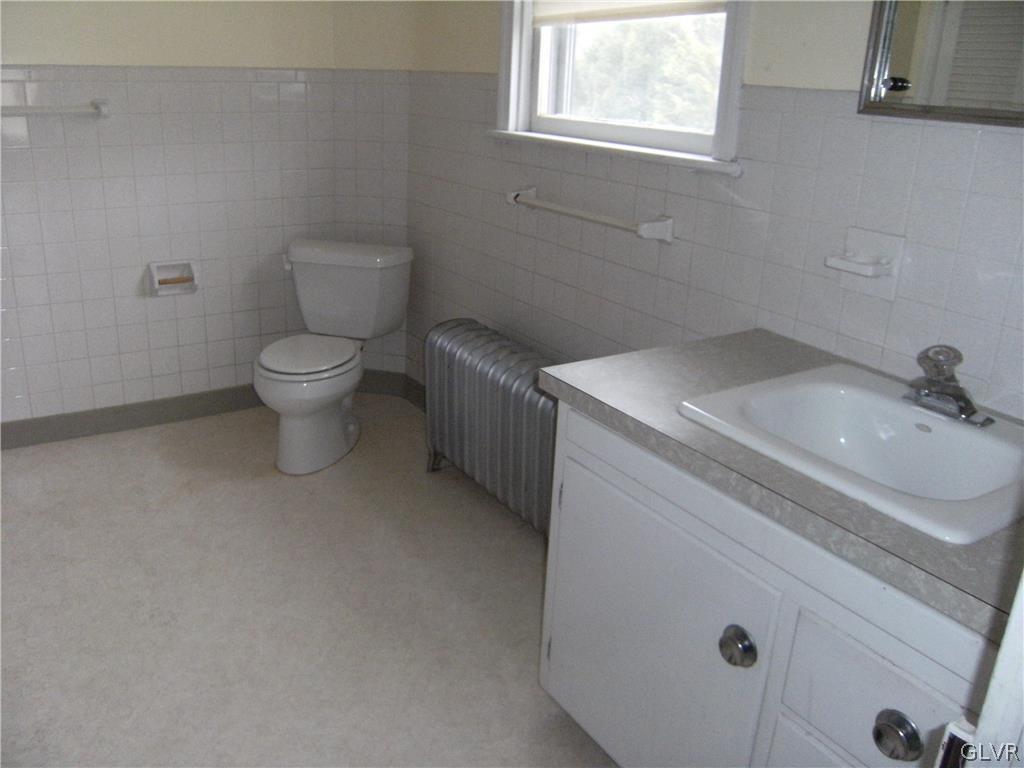1115 Main Street Slatington, PA 18080 - Photo 15 of 19 a bathroom with a sink toilet and window