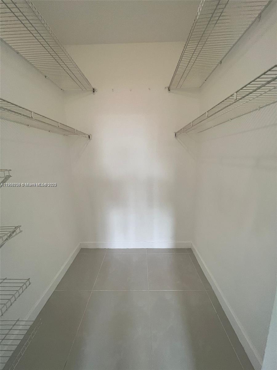 2001 Northwest 96th Terrace, Unit 10C Pembroke Pines, FL 33024 - Photo 7 of 10 a view of a room with racks on the wall