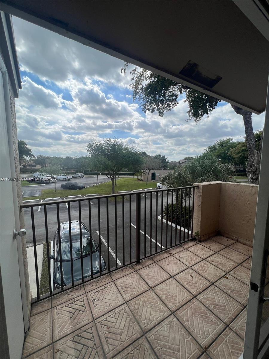 2001 Northwest 96th Terrace, Unit 10C Pembroke Pines, FL 33024 - Photo 10 of 10 a balcony with an outdoor space