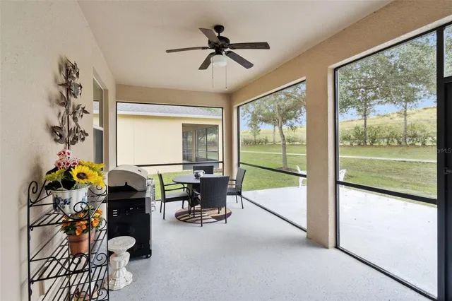 a work room with wooden floor and windows