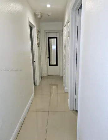 a view of a hallway with a room