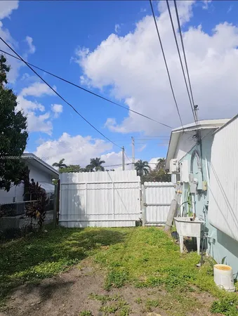 a view of a backyard with sitting area