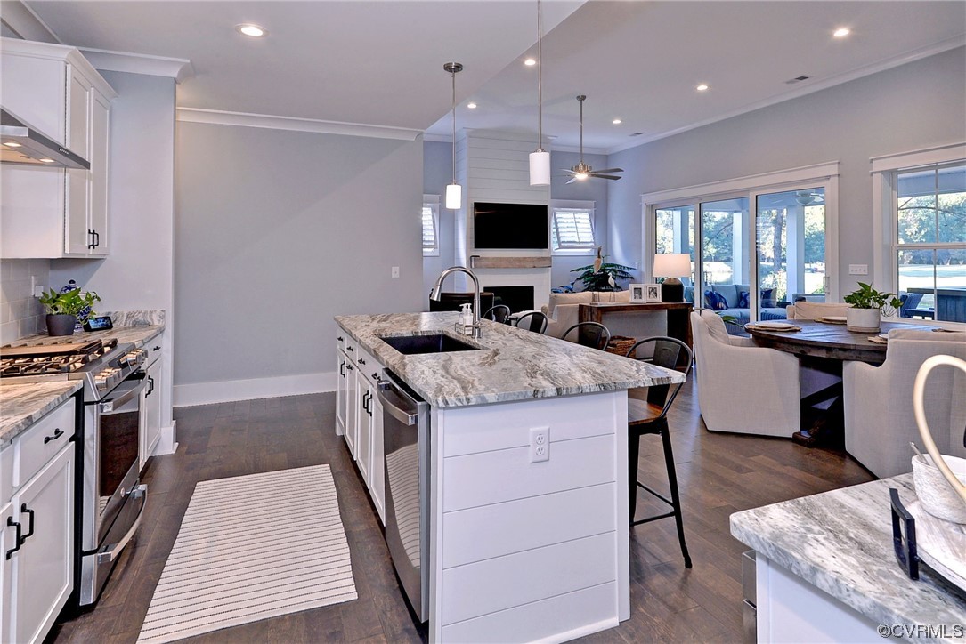 178 Old Course Loop Cape Charles, VA 23310 - Photo 13 of 49 a kitchen with granite countertop counter space a sink appliances and cabinets