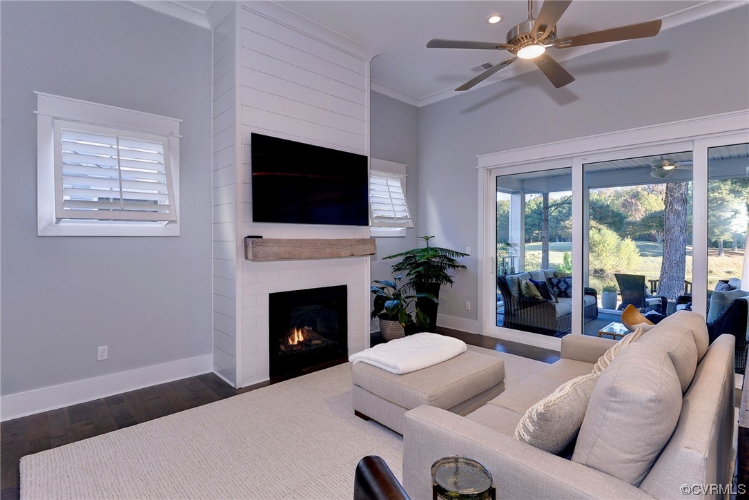178 Old Course Loop Cape Charles, VA 23310 - Photo 15 of 49 a living room with furniture a flat screen tv and a fireplace