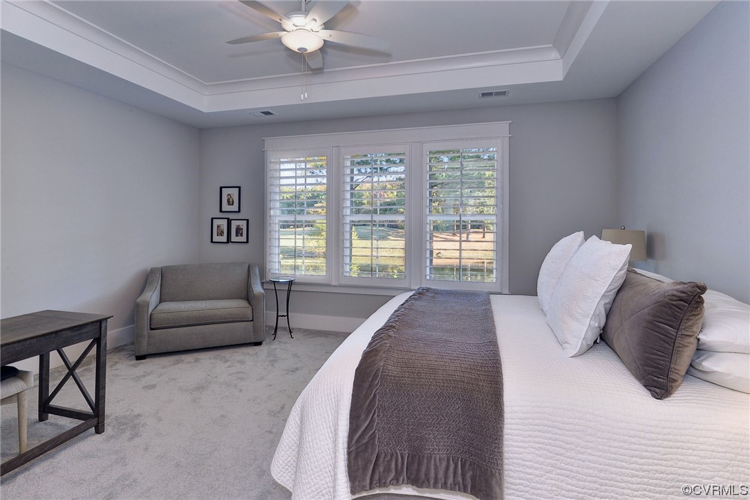 178 Old Course Loop Cape Charles, VA 23310 - Photo 21 of 49 a bedroom with a bed and a couch with window