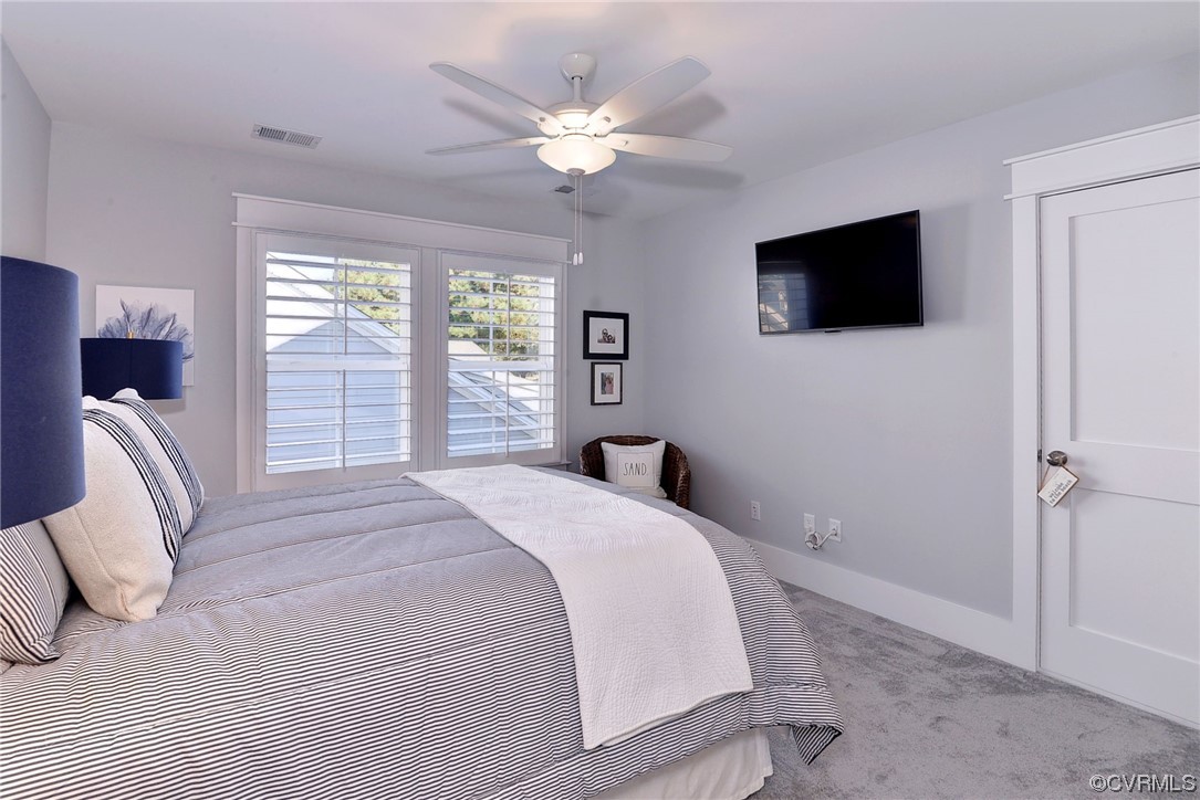 178 Old Course Loop Cape Charles, VA 23310 - Photo 30 of 49 a bedroom with a large bed and a flat screen tv