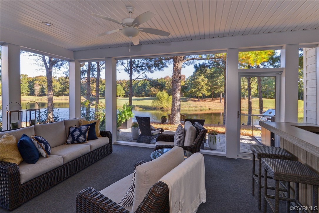 178 Old Course Loop Cape Charles, VA 23310 - Photo 33 of 49 a living room with furniture and floor to ceiling windows