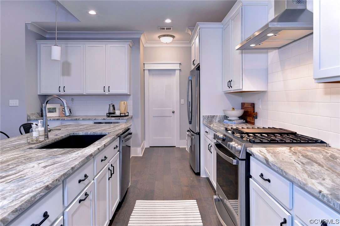 178 Old Course Loop Cape Charles, VA 23310 - Photo 10 of 49 a kitchen with stainless steel appliances granite countertop a sink stove and refrigerator