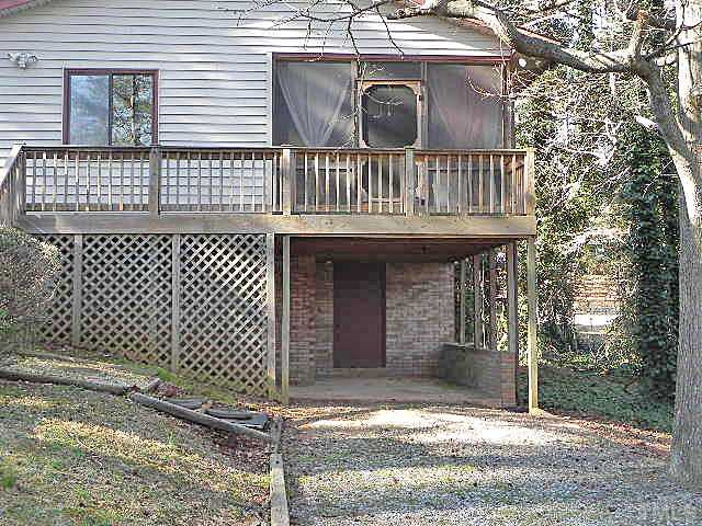 5522 Russell Road Durham, NC 27712 - Photo 20 of 22 a view of a brick house with large windows