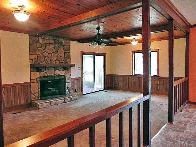 5522 Russell Road Durham, NC 27712 - Photo 5 of 22 a view of entryway with fireplace and hallway