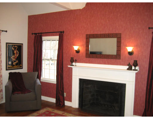 48 Payson Road Brookline, MA 02467 - Photo 8 of 15 a living room with furniture a flat screen tv and a fireplace