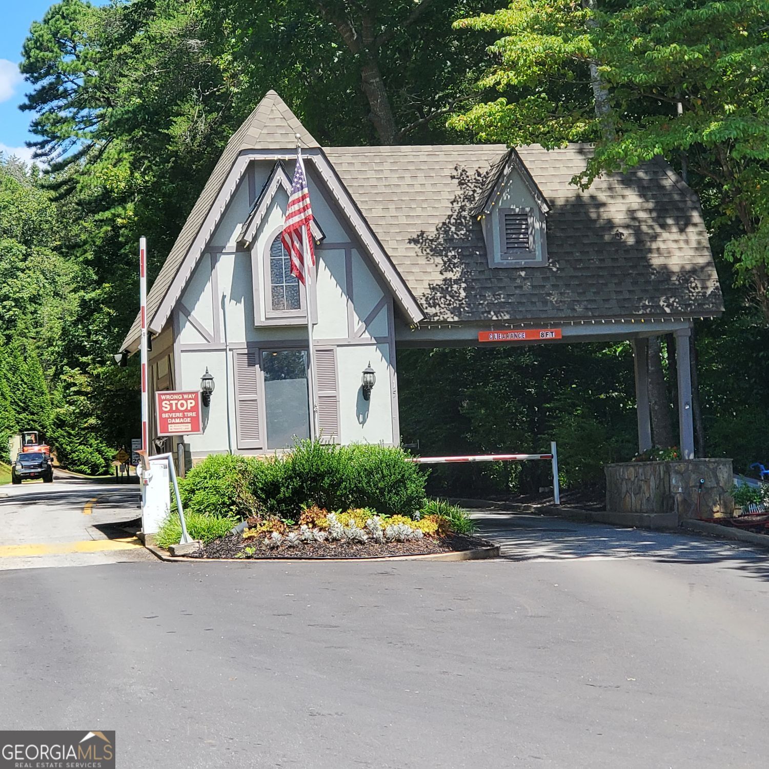 0 Rosen Strasse, Unit LOT Helen, GA 30545 - Photo 7 of 8 a front view of a house with a yard and garage