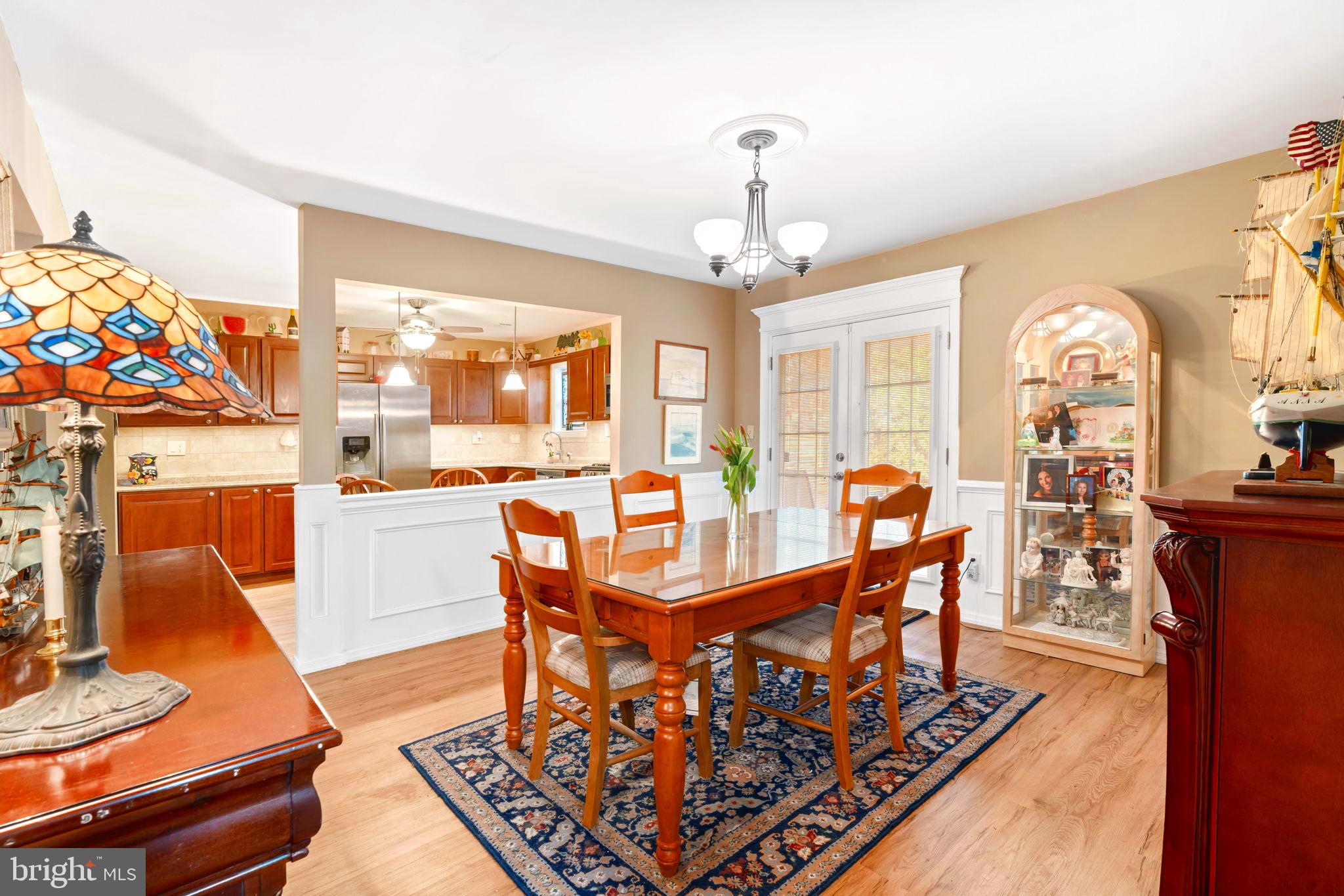 78 Lupus Lane Sewell, NJ 08080 - Photo 15 of 45 a view of a dining room with furniture a chandelier and wooden floor
