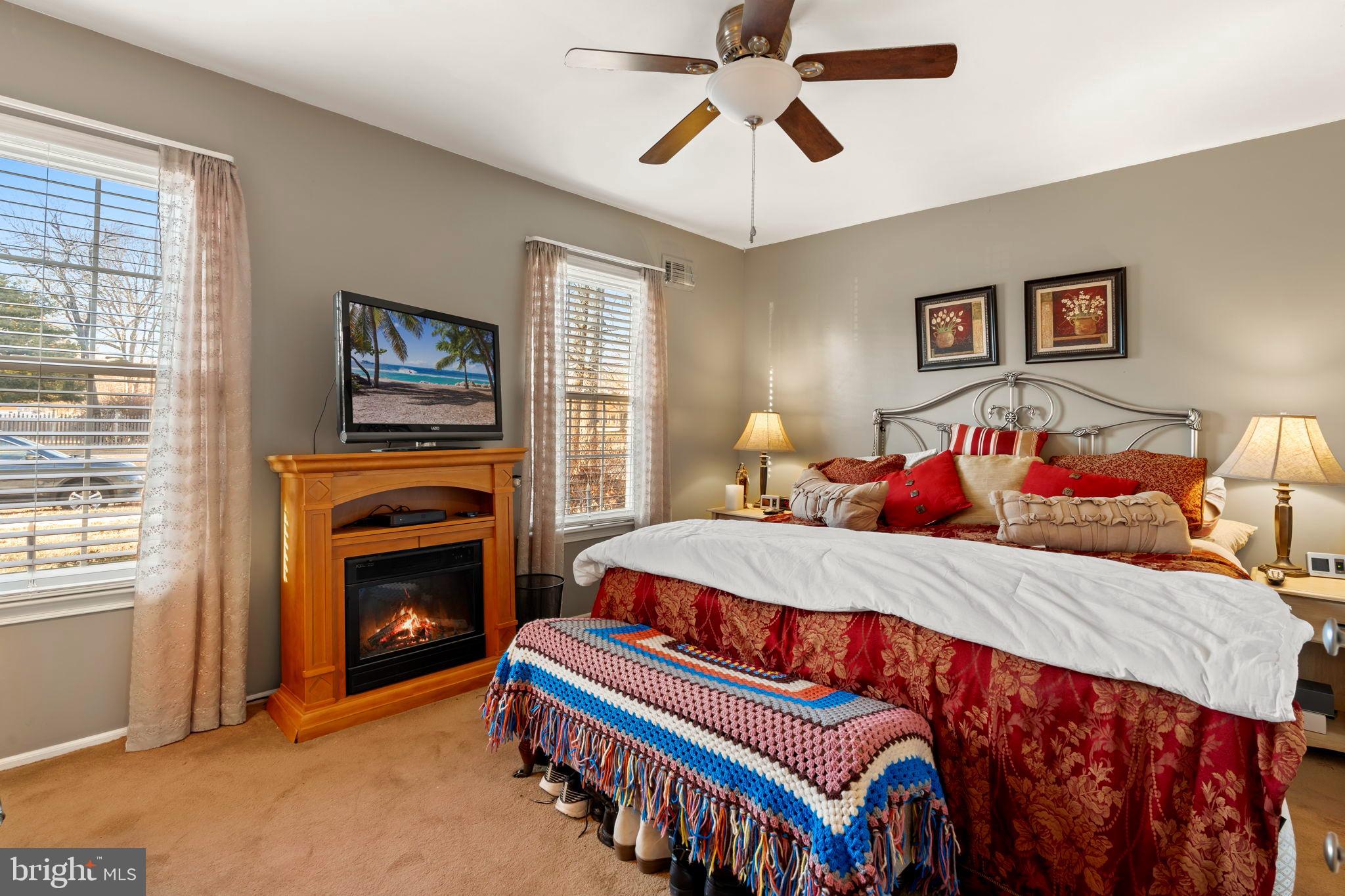 78 Lupus Lane Sewell, NJ 08080 - Photo 17 of 45 a bedroom with a bed and a chandelier