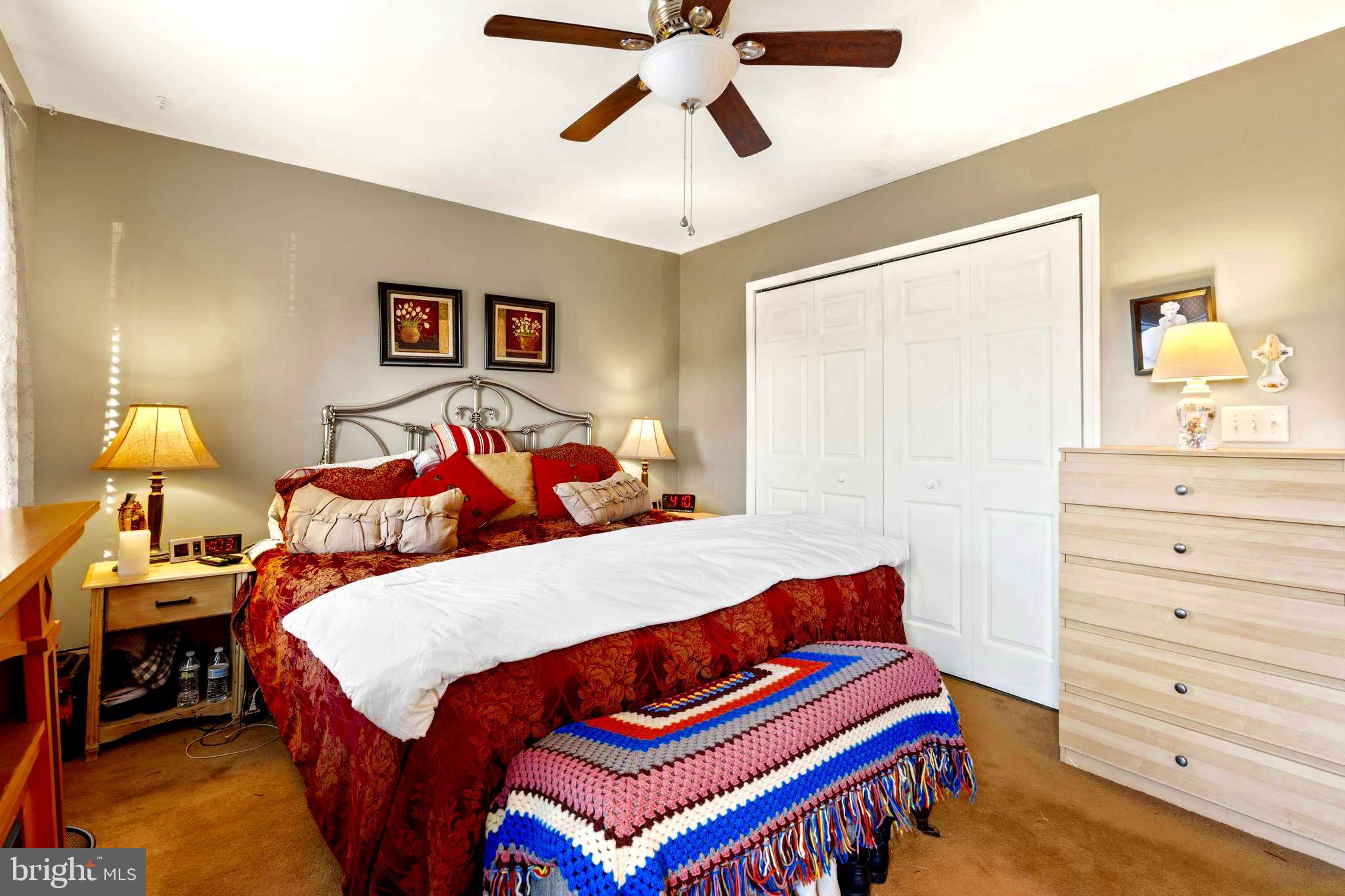 78 Lupus Lane Sewell, NJ 08080 - Photo 18 of 45 a bedroom with a bed and dresser with mirror