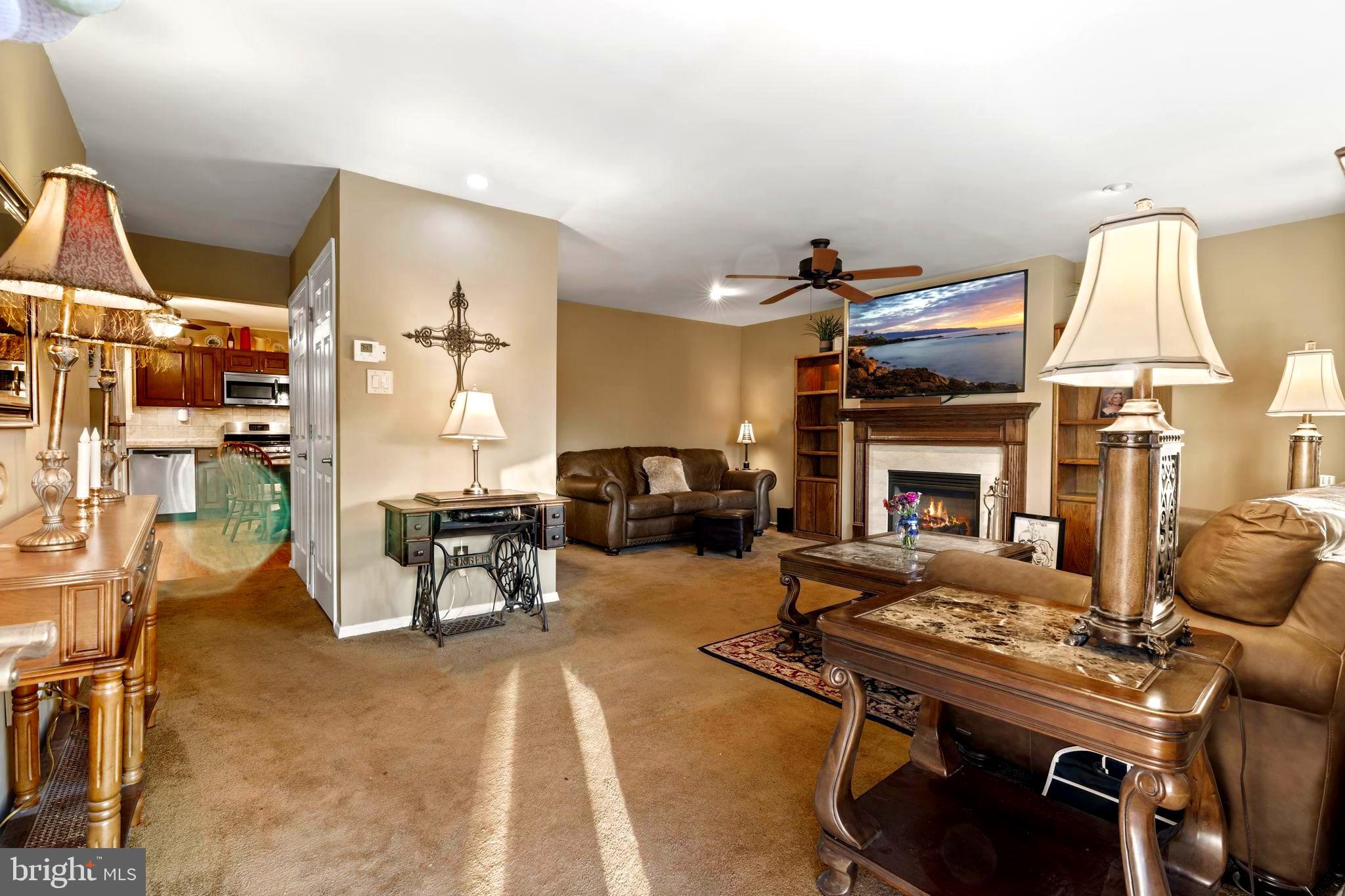 78 Lupus Lane Sewell, NJ 08080 - Photo 4 of 45 a living room with furniture a fireplace and a flat screen tv