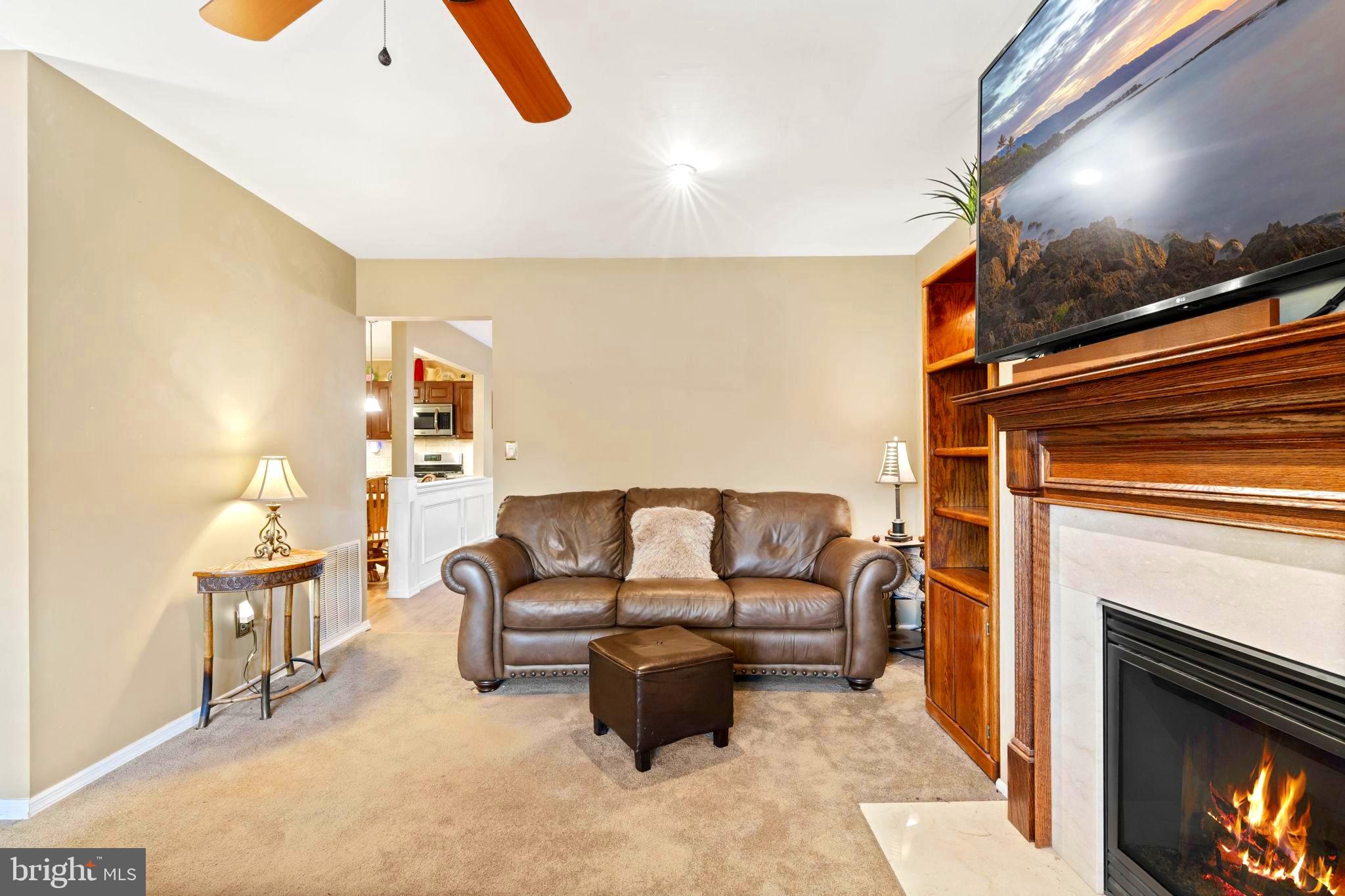 78 Lupus Lane Sewell, NJ 08080 - Photo 7 of 45 a living room with furniture and a fireplace