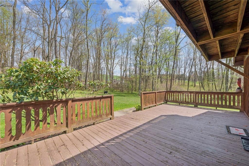 136 Bottom Road Mill Run, PA 15464 - Photo 22 of 26 a view of deck with wooden floor