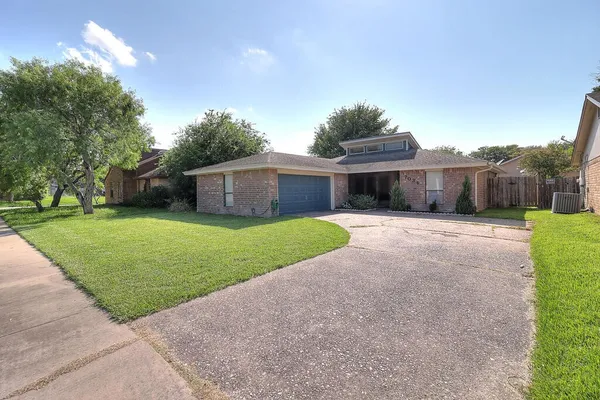 a view of a house with a yard and a porch