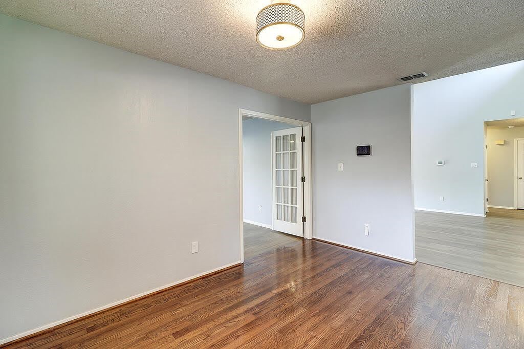 7034 Powderhorn Court Corpus Christi, TX 78413 - Photo 14 of 38 wooden floor in an empty room