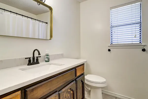 a close view of a sink and a toilet