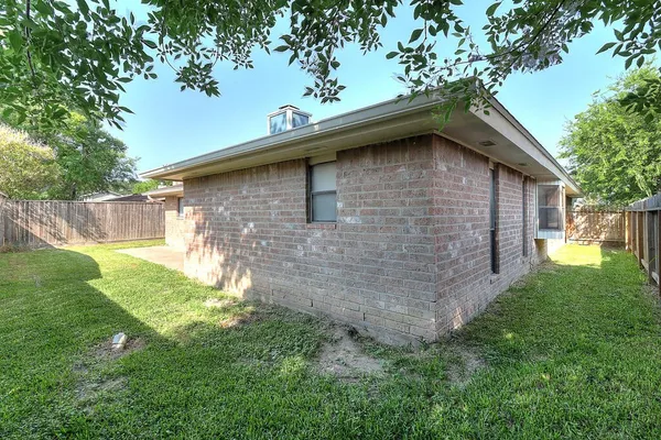 a backyard of a house with lots of green space