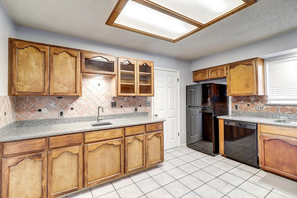 7034 Powderhorn Court Corpus Christi, TX 78413 - Photo 8 of 38 a kitchen with stainless steel appliances granite countertop a stove a sink and a refrigerator