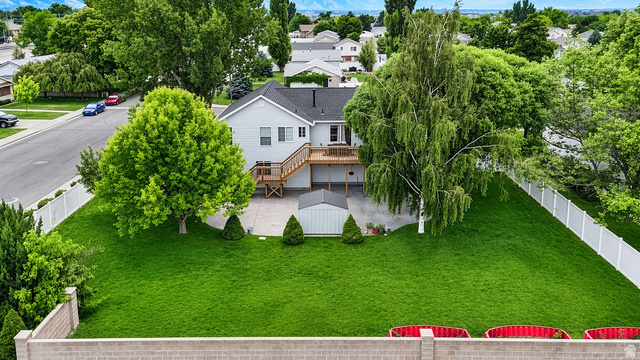 464 West Saddle Back Drive Springville, UT 84663 - Photo 2 of 15 Expansive green lawn with mature trees and a multi-level wood deck