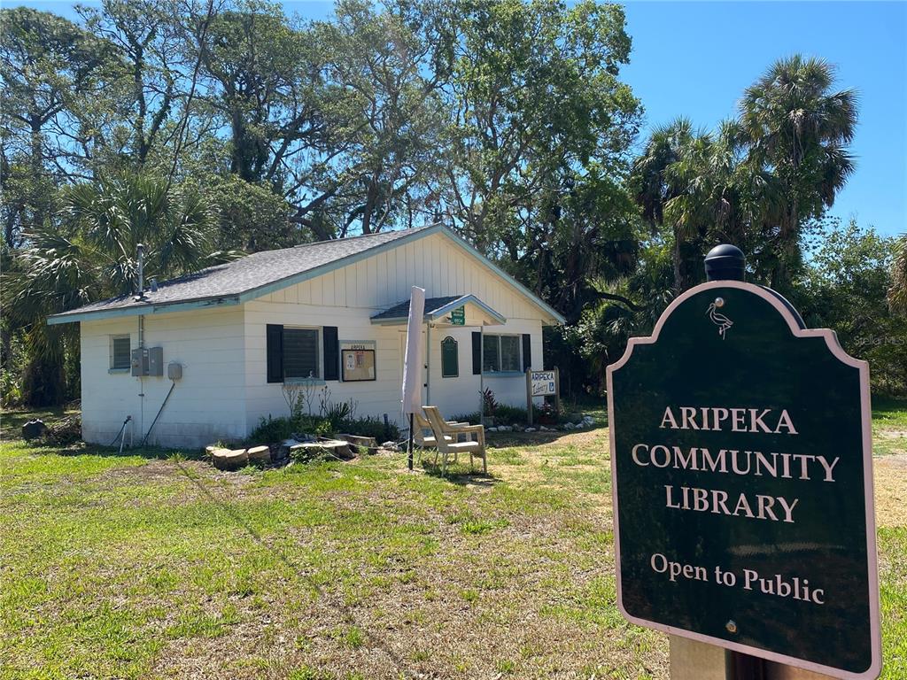 1578 Indian Bay Road Spring Hill, FL 34607 - Photo 44 of 51 a front view of a house with yard and trees in the background