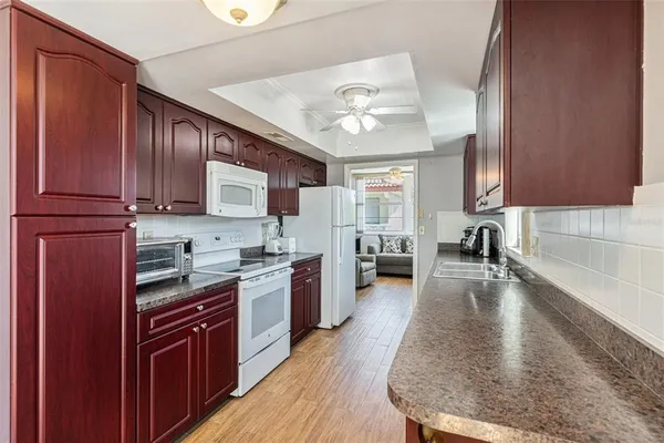 a bathroom with a toilet sink and a mirror