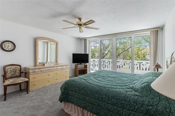 a bed room with a bed and a mirror