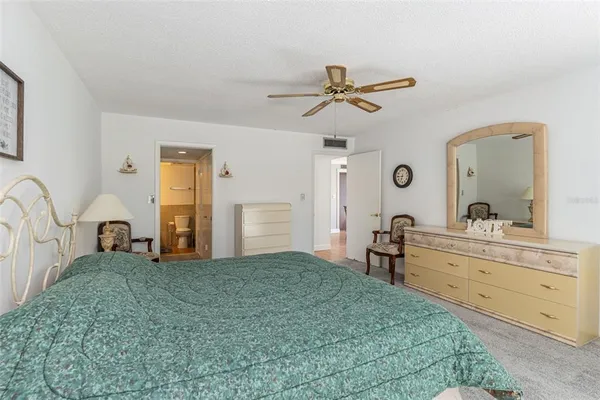 a bathroom with a sink toilet and a mirror