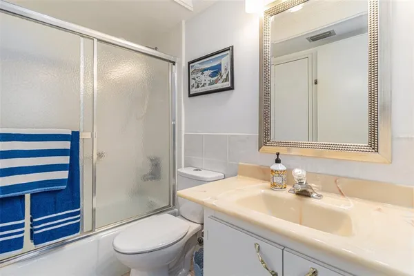 a view of a balcony with wooden fence and floor