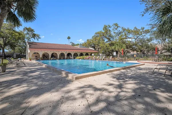 a view of a backyard with sitting area