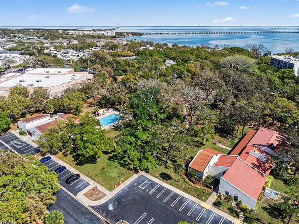 a room with pool table and windows
