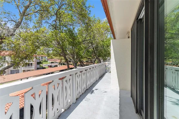 a kitchen with stainless steel appliances granite countertop a sink dishwasher stove and refrigerator