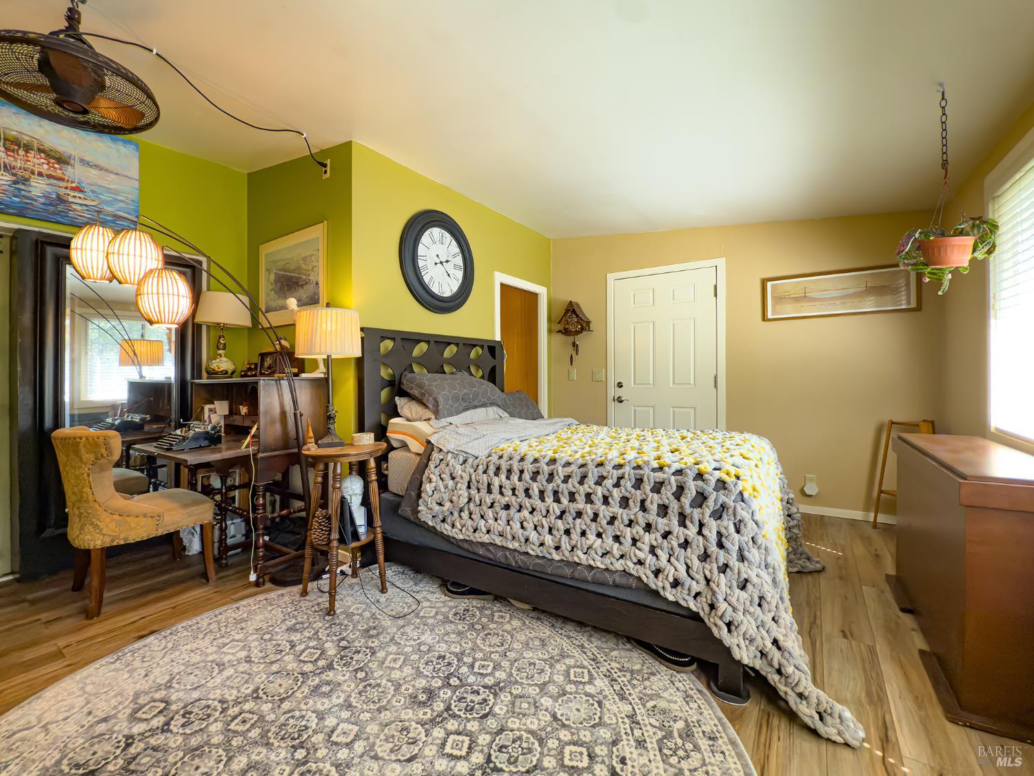 5845 Austin Creek Road Cazadero, CA 95421 - Photo 18 of 26 a bed room with a bed and a chair