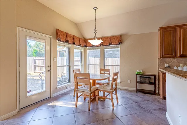 a kitchen with a stove a sink and a counter top space