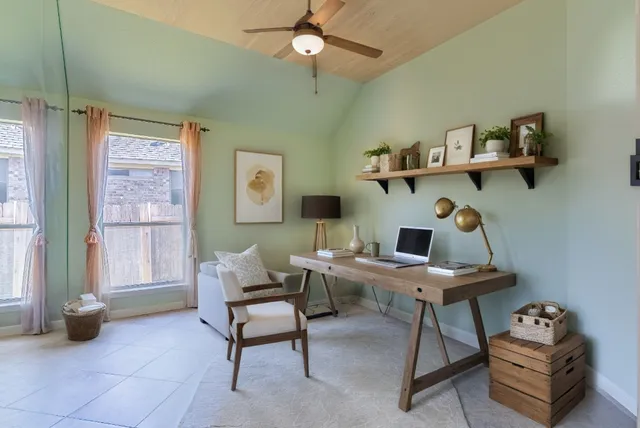 a view of an empty room with a fan