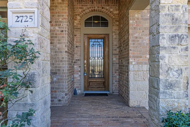 a view of front door of a house with stairs