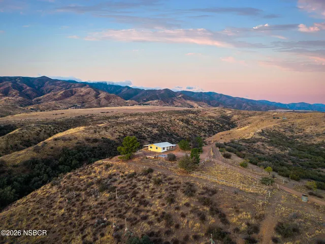 a kitchen with a sink a counter top space cabinets and stainless steel appliances