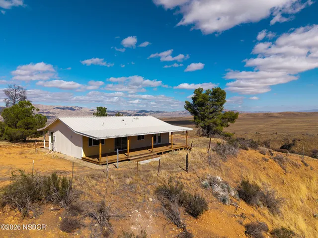 a aerial view of a house with a yard