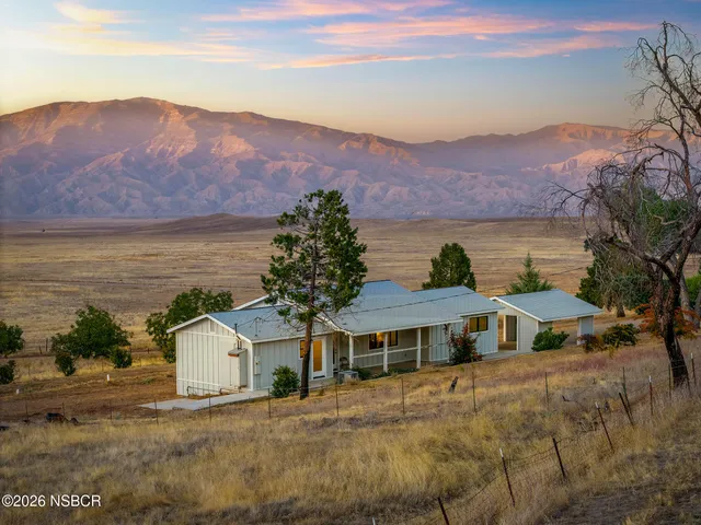 a view of a house with a ocean view