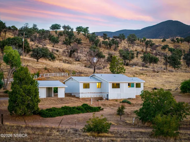 a aerial view of a house with a yard