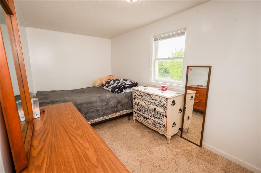 343 Whitestown Road Butler, PA 16001 - Photo 20 of 30 a bedroom with a bed and a dresser in it