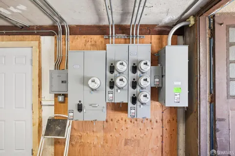 a view of walk in closet with window and chandelier