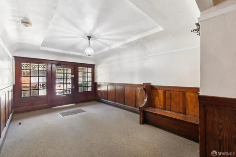 a view of an empty room with windows