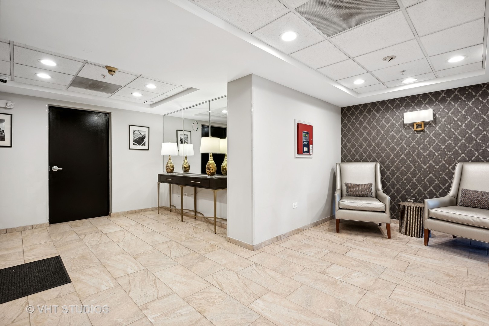 455 West Front Street, Unit 404 Wheaton, IL 60187 - Photo 3 of 16 a living room with furniture and a flat screen tv