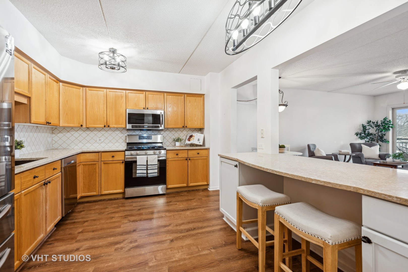 455 West Front Street, Unit 404 Wheaton, IL 60187 - Photo 5 of 16 a kitchen with a sink cabinets and window